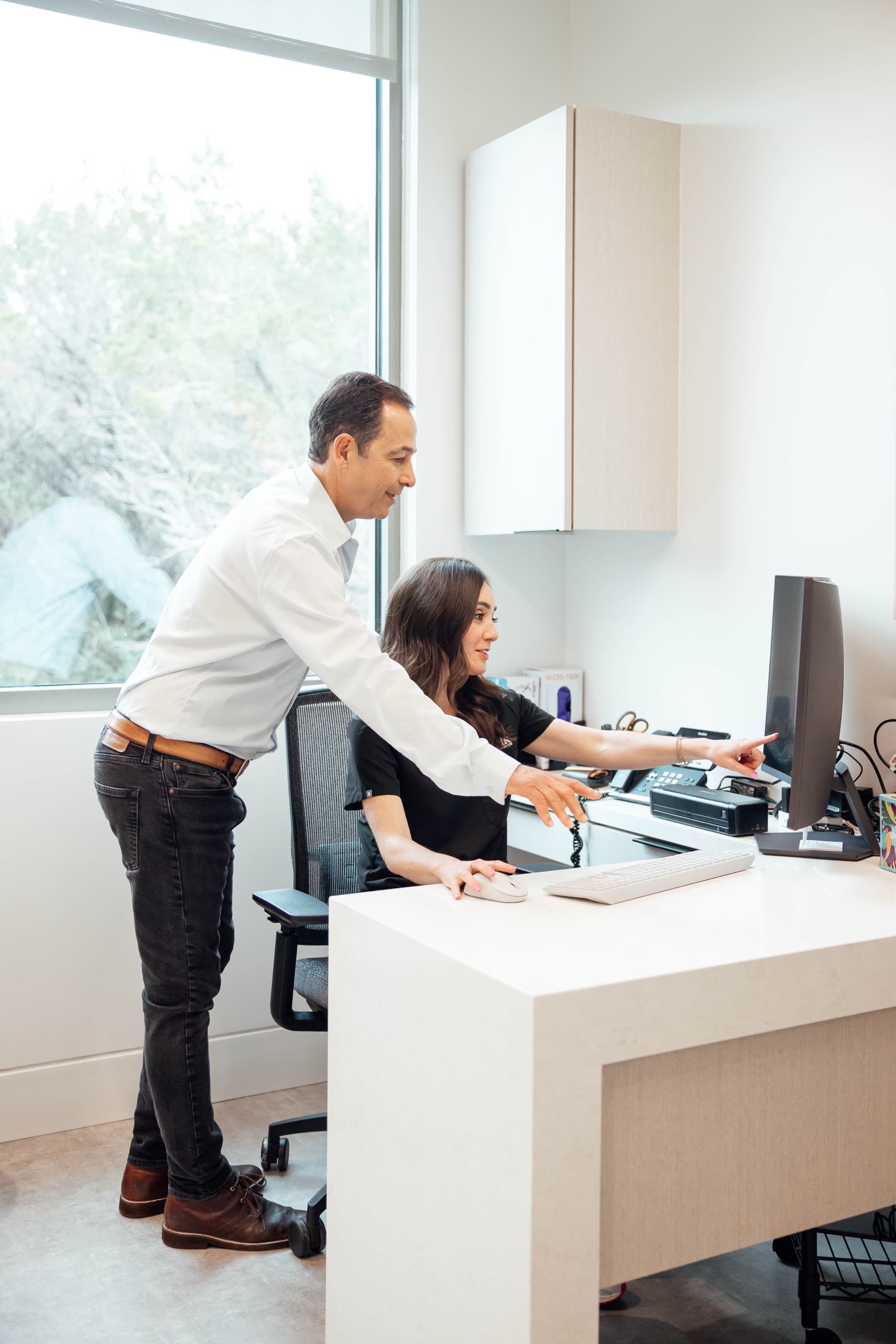 Dr. Kunik and team member reviewing treatment plan